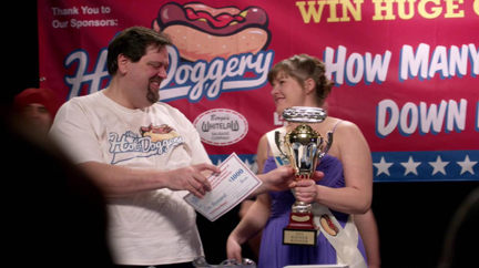 Wayne wins the hot dog eating contest. Wayne wins the hot dog eating contest.